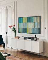 Spring Patches by Michael Mullan. shown as a framed stretched canvas in a living room above a console. Available as a archival giclee rolled canvas, fine art paper, or poster print. SKU 11486i.