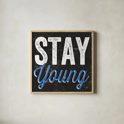 Stay Young by Michael Mullan. Shown in a natural wood glass frame for a timeless modern aesthetic. Available as an archival giclee rolled canvas, fine art paper, or poster print. SKU 13852a.
