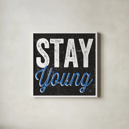 Stay Young by Michael Mullan. Shown in a crisp white glass frame for a clean and minimalist style. Available as an archival giclee rolled canvas, fine art paper, or poster print. SKU 13852a.