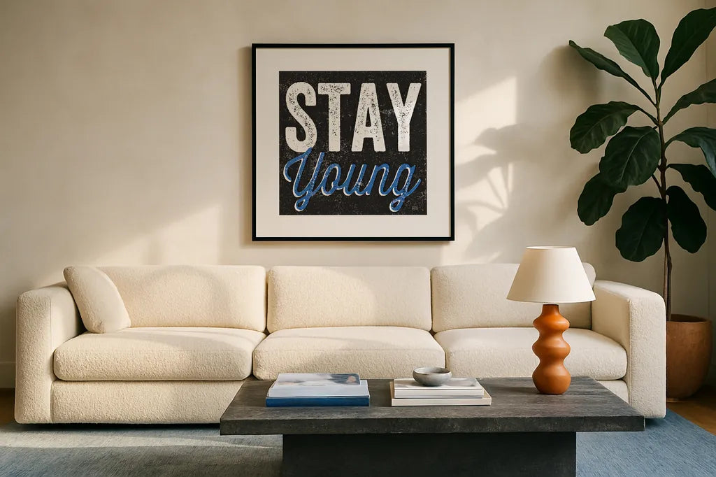 Stay Young by Michael Mullan. Displayed in a glass frame with matte in a clean modern living room. Available as an archival giclee rolled canvas, fine art paper, or poster print. SKU 13852a.