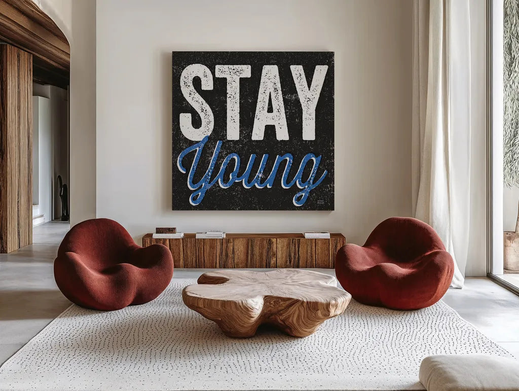 Stay Young by Michael Mullan. Shown as extra-large giant wall art in a modern living room. Available as an archival giclee rolled canvas, fine art paper, or poster print. SKU 13852a.