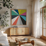 Triangulawesome Color IV by Michael Mullan. Shown in a natural wood frame in a cozy modern living room. Available as an archival giclee rolled canvas, fine art paper, or poster print. SKU 52648a.
