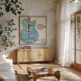 Type Guitar Colorful Square II by Michael Mullan. Shown in a natural wood frame in a cozy modern living room. Available as an archival giclee rolled canvas, fine art paper, or poster print. SKU 48418a.