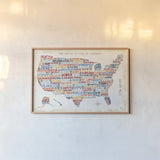 US City Map by Michael Mullan. shown as a paper print in a natural frame. Available as a archival giclee rolled canvas, fine art paper, or poster print. SKU 18273i.