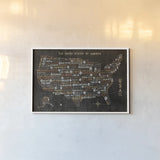 US City Map Black by Michael Mullan. shown as a paper print in a white frame. Available as a archival giclee rolled canvas, fine art paper, or poster print. SKU 20462i.
