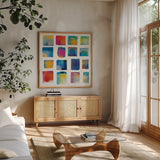 Vibrations Square I White by Michael Mullan. Shown in a natural wood frame in a cozy modern living room. Available as an archival giclee rolled canvas, fine art paper, or poster print. SKU 51332a.