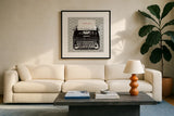 Vintage Analog Typewriter by Michael Mullan. Displayed in a glass frame with matte in a clean modern living room. Available as an archival giclee rolled canvas, fine art paper, or poster print. SKU 12408a.