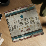 Vintage Bakery Sign by Michael Mullan. Shown as a detailed flat fine art print, highlighting archival giclee quality. Available as an archival giclee rolled canvas, fine art paper, or poster print. SKU 51286a.