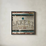 Vintage Bakery Sign by Michael Mullan. Shown in a sleek black glass frame for a contemporary gallery look. Available as an archival giclee rolled canvas, fine art paper, or poster print. SKU 51286a.