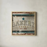 Vintage Bakery Sign by Michael Mullan. Shown in a natural wood glass frame for a timeless modern aesthetic. Available as an archival giclee rolled canvas, fine art paper, or poster print. SKU 51286a.