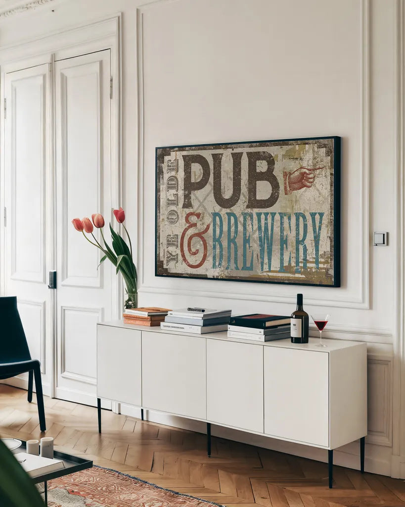 Vintage Pub Brewery Sign by Michael Mullan. shown as a framed stretched canvas in a living room above a console. Available as a archival giclee rolled canvas, fine art paper, or poster print. SKU 51290i.