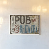 Vintage Pub Brewery Sign by Michael Mullan. shown as a paper print in a white frame. Available as a archival giclee rolled canvas, fine art paper, or poster print. SKU 51290i.