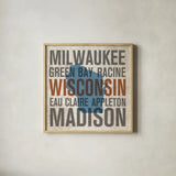 Wisconsin by Michael Mullan. Shown in a natural wood glass frame for a timeless modern aesthetic. Available as an archival giclee rolled canvas, fine art paper, or poster print. SKU 18076a.