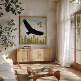 Woodland Dwellers Black Eagle by Michael Mullan. Shown in a natural wood frame in a cozy modern living room. Available as an archival giclee rolled canvas, fine art paper, or poster print. SKU 50494a.