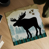 Woodland Dwellers Black Moose Plaid by Michael Mullan. Shown as a detailed flat fine art print, highlighting archival giclee quality. Available as an archival giclee rolled canvas, fine art paper, or poster print. SKU 50495a.