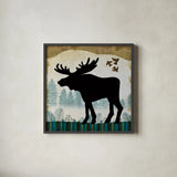 Woodland Dwellers Black Moose Plaid by Michael Mullan. Shown in a sleek black glass frame for a contemporary gallery look. Available as an archival giclee rolled canvas, fine art paper, or poster print. SKU 50495a.