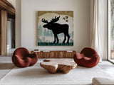 Woodland Dwellers Black Moose Plaid by Michael Mullan. Shown as extra-large giant wall art in a modern living room. Available as an archival giclee rolled canvas, fine art paper, or poster print. SKU 50495a.