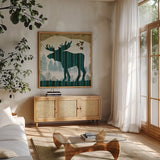 Woodland Dwellers Moose by Michael Mullan. Shown in a natural wood frame in a cozy modern living room. Available as an archival giclee rolled canvas, fine art paper, or poster print. SKU 41749a.