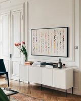 Candy Bars by Mike Schick. shown as a framed stretched canvas in a living room above a console. Available as a archival giclee rolled canvas, fine art paper, or poster print. SKU 32091i.
