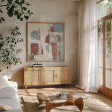 Down to the Street Cool by Mike Schick. Shown in a natural wood frame in a cozy modern living room. Available as an archival giclee rolled canvas, fine art paper, or poster print. SKU 53111a.