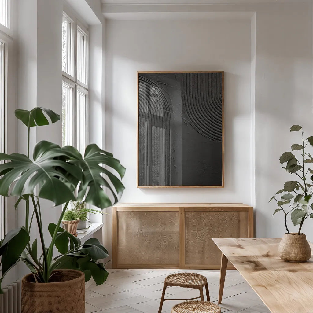 Embrace I Black by Mike Schick. shown as a print in a natural wood frame in a dining room. Available as a archival giclee rolled canvas, fine art paper, or poster print. SKU 86567h.