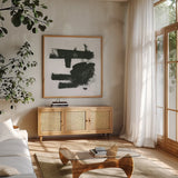 Gold and Black Elements XV by Mike Schick. Shown in a natural wood frame in a cozy modern living room. Available as an archival giclee rolled canvas, fine art paper, or poster print. SKU 19471a.