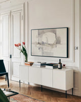 Improvisation I Gray by Mike Schick. shown as a framed stretched canvas in a living room above a console. Available as a archival giclee rolled canvas, fine art paper, or poster print. SKU 28337i.