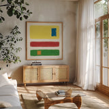 Isole Bright Primary by Mike Schick. Shown in a natural wood frame in a cozy modern living room. Available as an archival giclee rolled canvas, fine art paper, or poster print. SKU 82312a.