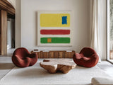 Isole Bright Primary by Mike Schick. Shown as extra-large giant wall art in a modern living room. Available as an archival giclee rolled canvas, fine art paper, or poster print. SKU 82312a.