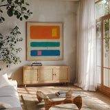 Isole Orange by Mike Schick. Shown in a natural wood frame in a cozy modern living room. Available as an archival giclee rolled canvas, fine art paper, or poster print. SKU 22606a.