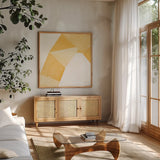 Paper Work I Yellow by Mike Schick. Shown in a natural wood frame in a cozy modern living room. Available as an archival giclee rolled canvas, fine art paper, or poster print. SKU 51728a.