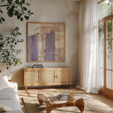 Passage I Blush Purple by Mike Schick. Shown in a natural wood frame in a cozy modern living room. Available as an archival giclee rolled canvas, fine art paper, or poster print. SKU 42716a.