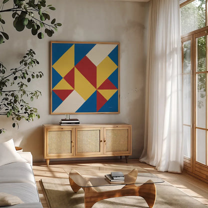 Triangles I Bright Primary by Mike Schick. Shown in a natural wood frame in a cozy modern living room. Available as an archival giclee rolled canvas, fine art paper, or poster print. SKU 82310a.