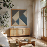 Triangles I Teal Crop by Mike Schick. Shown in a natural wood frame in a cozy modern living room. Available as an archival giclee rolled canvas, fine art paper, or poster print. SKU 79789a.