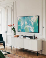 Coastal Feel I by Moira Hershey. shown as a framed stretched canvas in a living room above a console. Available as a archival giclee rolled canvas, fine art paper, or poster print. SKU 41615i.