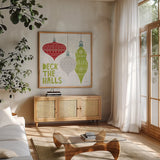 Deck The Halls Red III by Moira Hershey. Shown in a natural wood frame in a cozy modern living room. Available as an archival giclee rolled canvas, fine art paper, or poster print. SKU 38413a.