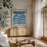 Delighted III Blue by Moira Hershey. Shown in a natural wood frame in a cozy modern living room. Available as an archival giclee rolled canvas, fine art paper, or poster print. SKU 80396a.