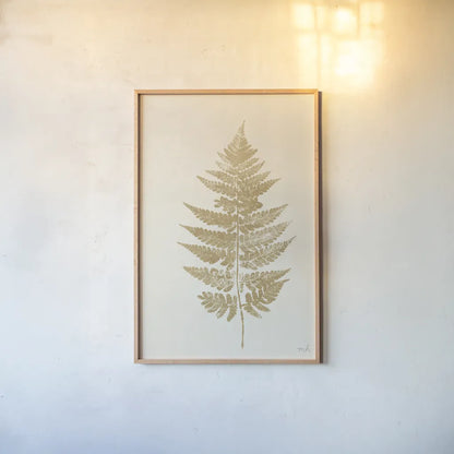 Fern Print I Gold No Shiplap by Moira Hershey. shown as a paper print in a natural frame. Available as a archival giclee rolled canvas, fine art paper, or poster print. SKU 57690h.