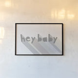 Hey Baby by Moira Hershey. shown as a paper print in a black flame. Available as a archival giclee rolled canvas, fine art paper, or poster print. SKU 62008i.