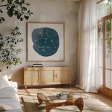 Horoscope Aquarius by Moira Hershey. Shown in a natural wood frame in a cozy modern living room. Available as an archival giclee rolled canvas, fine art paper, or poster print. SKU 48899a.