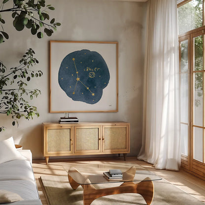 Horoscope Cancer by Moira Hershey. Shown in a natural wood frame in a cozy modern living room. Available as an archival giclee rolled canvas, fine art paper, or poster print. SKU 48900a.