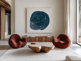 Horoscope Capricorn by Moira Hershey. Shown as extra-large giant wall art in a modern living room. Available as an archival giclee rolled canvas, fine art paper, or poster print. SKU 48901a.