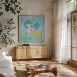 Magical Mermaid II by Moira Hershey. Shown in a natural wood frame in a cozy modern living room. Available as an archival giclee rolled canvas, fine art paper, or poster print. SKU 29821a.