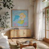 Magical Mermaid IV by Moira Hershey. Shown in a natural wood frame in a cozy modern living room. Available as an archival giclee rolled canvas, fine art paper, or poster print. SKU 29823a.