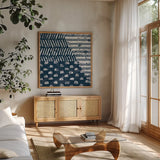 Mark Making Tile I by Moira Hershey. Shown in a natural wood frame in a cozy modern living room. Available as an archival giclee rolled canvas, fine art paper, or poster print. SKU 33240a.