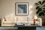 Mark Making Tile II by Moira Hershey. Displayed in a glass frame with matte in a clean modern living room. Available as an archival giclee rolled canvas, fine art paper, or poster print. SKU 33241a.