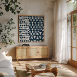 Mark Making Tile III by Moira Hershey. Shown in a natural wood frame in a cozy modern living room. Available as an archival giclee rolled canvas, fine art paper, or poster print. SKU 33242a.