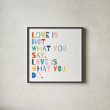 Rainbow Words I by Moira Hershey. Shown in a sleek black glass frame for a contemporary gallery look. Available as an archival giclee rolled canvas, fine art paper, or poster print. SKU 64357a.