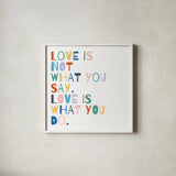 Rainbow Words I by Moira Hershey. Shown in a crisp white glass frame for a clean and minimalist style. Available as an archival giclee rolled canvas, fine art paper, or poster print. SKU 64357a.