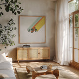 Rainbow Words II Crop by Moira Hershey. Shown in a natural wood frame in a cozy modern living room. Available as an archival giclee rolled canvas, fine art paper, or poster print. SKU 59230a.